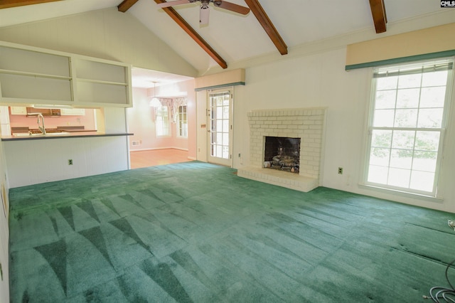 2115 Ohara Ct, Columbia, SC 29204 - unfurnished living room with ceiling fan, carpet, a brick fireplace, and healthy amount of natural light