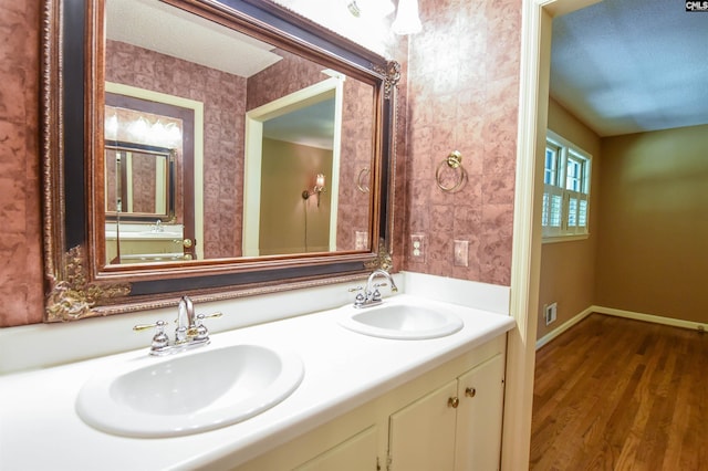 2115 Ohara Ct, Columbia, SC 29204 - bathroom with double vanity and wood finished floors