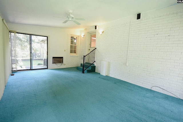 2115 Ohara Ct, Columbia, SC 29204 - unfurnished living room with brick wall, carpet, ceiling fan, stairs, and heating unit