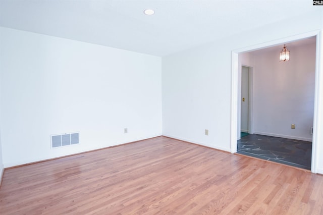 2115 Ohara Ct, Columbia, SC 29204 - unfurnished room with light wood-type flooring, recessed lighting, and a chandelier