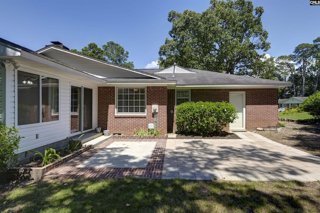 136 Traylors Gate Cir, Irmo, SC 29063 - rear view of house with a patio, brick siding, and entry steps