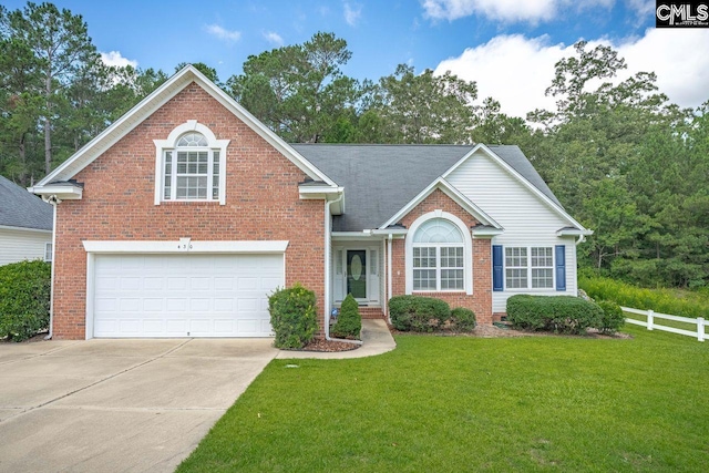 430 Plantation Pointe Dr, Elgin, SC 29045 - traditional-style house featuring brick siding, concrete driveway, and an attached garage