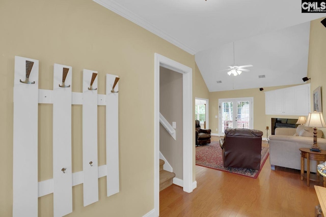 430 Plantation Pointe Dr, Elgin, SC 29045 - corridor with light wood finished floors, lofted ceiling, stairway, and ornamental molding