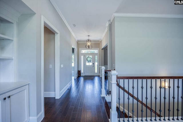 605 Flycatcher Ln, Blythewood, SC 29016 - hallway featuring a chandelier, dark wood finished floors, ornamental molding, and built in features