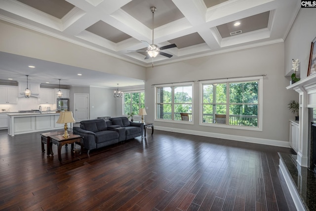 605 Flycatcher Ln, Blythewood, SC 29016 - living room with a ceiling fan, beamed ceiling, a high ceiling, crown molding, and a high end fireplace