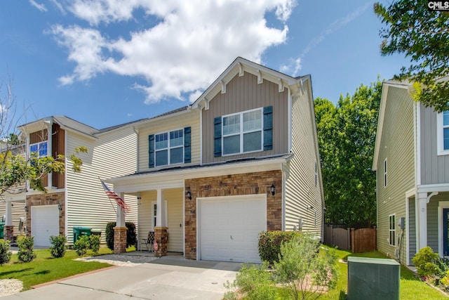 157 Autumn Stroll Ct, Lexington, SC 29072 - view of front of house with stone siding, a garage, board and batten siding, concrete driveway, and a porch