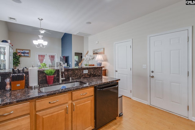157 Autumn Stroll Ct, Lexington, SC 29072 - kitchen with black dishwasher, light wood finished floors, dark stone counters, hanging light fixtures, and vaulted ceiling