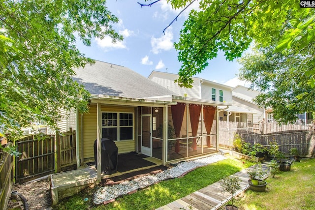 157 Autumn Stroll Ct, Lexington, SC 29072 - rear view of house featuring a sunroom and roof with shingles