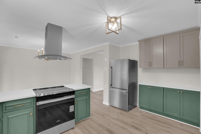 898 Perry Blvd, Sumter, SC 29154 - kitchen featuring appliances with stainless steel finishes, green cabinets, island range hood, light countertops, and light wood-type flooring
