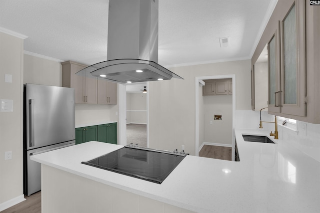 898 Perry Blvd, Sumter, SC 29154 - kitchen with island range hood, freestanding refrigerator, stovetop, a peninsula, and crown molding