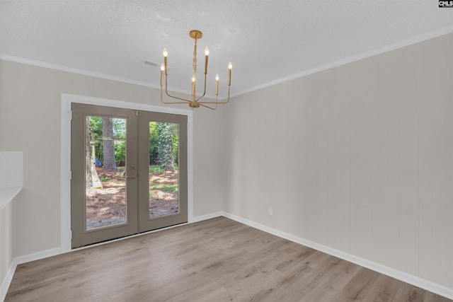 898 Perry Blvd, Sumter, SC 29154 - unfurnished dining area with french doors, a chandelier, wood finished floors, and crown molding