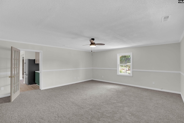 898 Perry Blvd, Sumter, SC 29154 - spare room featuring light colored carpet, a textured ceiling, ceiling fan, and french doors