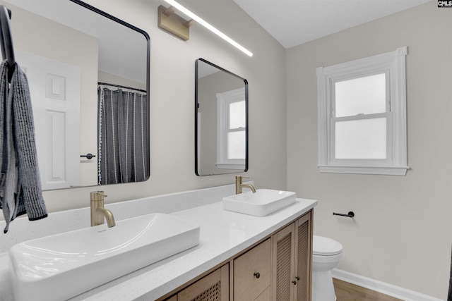 898 Perry Blvd, Sumter, SC 29154 - bathroom with double vanity and wood finished floors