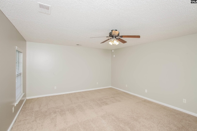 141 Wigmore Ln, Lexington, SC 29072 - empty room featuring a ceiling fan, light carpet, and a textured ceiling
