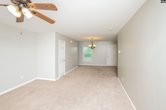 141 Wigmore Ln, Lexington, SC 29072 - unfurnished room featuring light colored carpet, a chandelier, and a ceiling fan