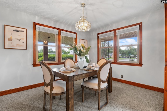 623 Hook Ave, West Columbia, SC 29169 - dining room with carpet floors and a chandelier