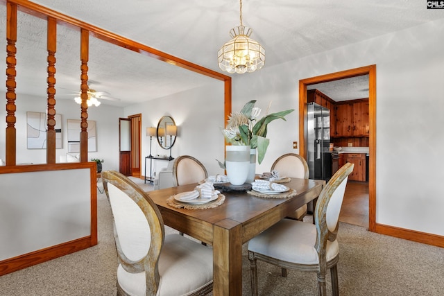 623 Hook Ave, West Columbia, SC 29169 - dining room featuring light carpet, a chandelier, a textured ceiling, and a ceiling fan