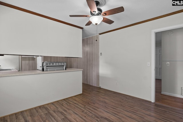 2017 Wellington Rd, Cayce, SC 29033 - spare room featuring wood finished floors, a ceiling fan, ornamental molding, and a smoke detector