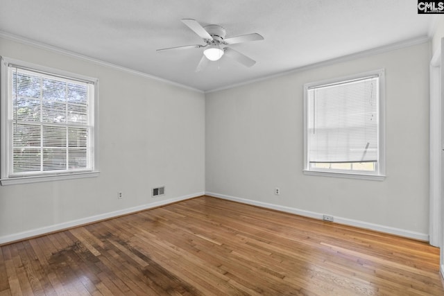 2017 Wellington Rd, Cayce, SC 29033 - spare room featuring wood-type flooring, ornamental molding, and ceiling fan