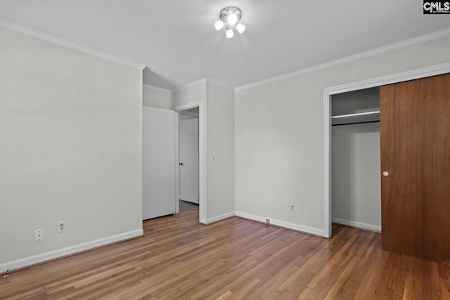 2017 Wellington Rd, Cayce, SC 29033 - unfurnished bedroom featuring wood finished floors, ornamental molding, and a closet