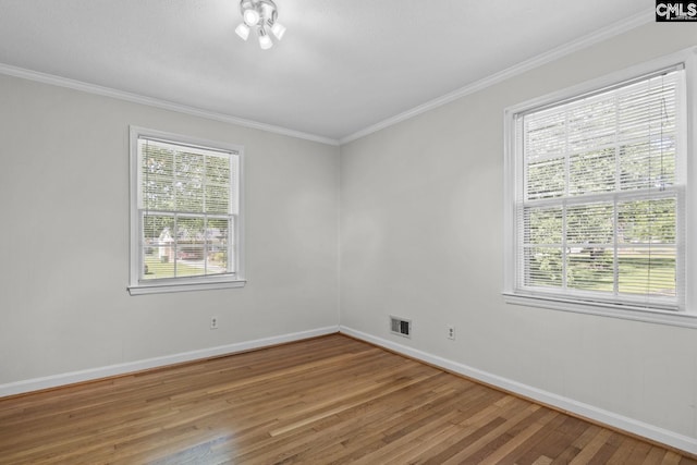 2017 Wellington Rd, Cayce, SC 29033 - empty room featuring plenty of natural light, light wood-type flooring, and ornamental molding