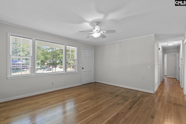 2017 Wellington Rd, Cayce, SC 29033 - empty room featuring attic access, a ceiling fan, wood-type flooring, and plenty of natural light