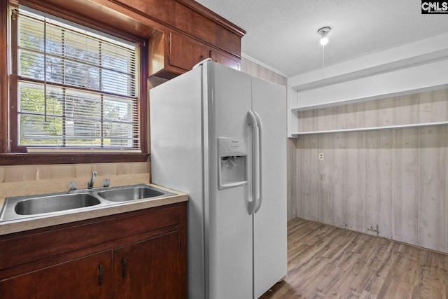 2017 Wellington Rd, Cayce, SC 29033 - kitchen featuring white refrigerator with ice dispenser, light wood-style floors, light countertops, and a textured ceiling