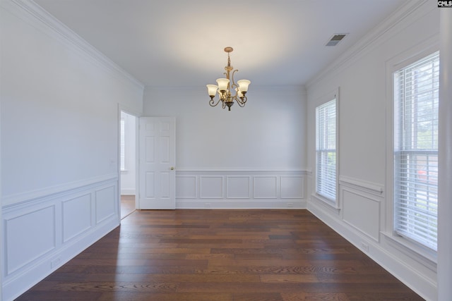 400 Mallet Hill Rd Unit B1, Columbia, SC 29223 - empty room featuring a chandelier, crown molding, a wainscoted wall, dark wood-type flooring, and a decorative wall