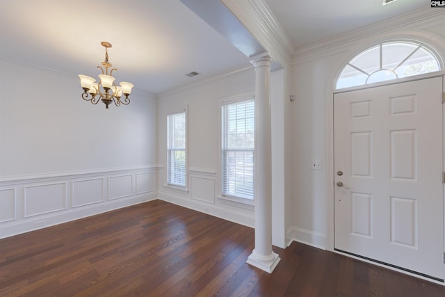 400 Mallet Hill Rd Unit B1, Columbia, SC 29223 - entryway featuring ornate columns, a chandelier, ornamental molding, dark wood-type flooring, and wainscoting