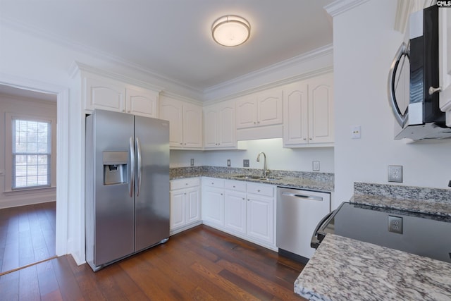 400 Mallet Hill Rd Unit B1, Columbia, SC 29223 - kitchen with appliances with stainless steel finishes, ornamental molding, light stone counters, white cabinets, and dark wood-type flooring