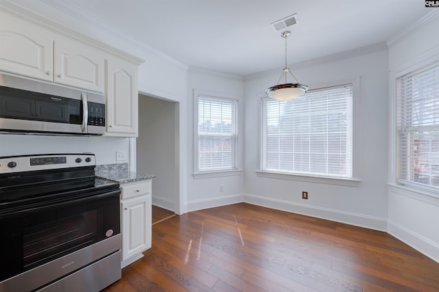 400 Mallet Hill Rd Unit B1, Columbia, SC 29223 - kitchen with stainless steel appliances, white cabinetry, light stone countertops, dark wood-style flooring, and plenty of natural light