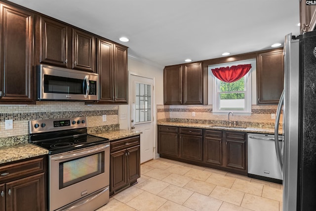 811 Rosedale Rd, West Columbia, SC 29170 - kitchen featuring stainless steel appliances, backsplash, ornamental molding, dark brown cabinets, and recessed lighting