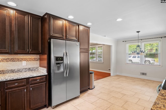 811 Rosedale Rd, West Columbia, SC 29170 - kitchen featuring stainless steel refrigerator with ice dispenser, a chandelier, crown molding, backsplash, and dark brown cabinetry
