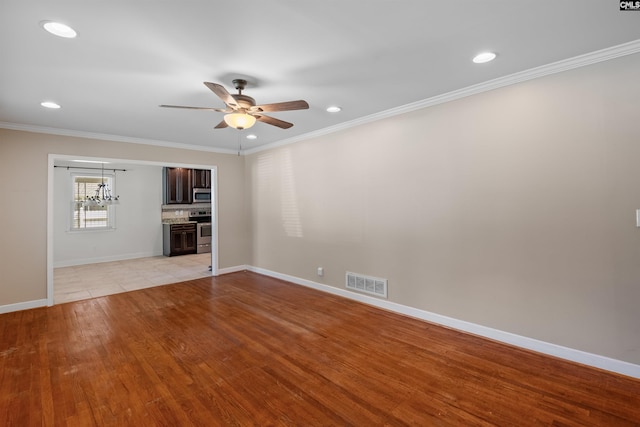 811 Rosedale Rd, West Columbia, SC 29170 - unfurnished living room featuring ornamental molding, a ceiling fan, recessed lighting, and light wood-type flooring