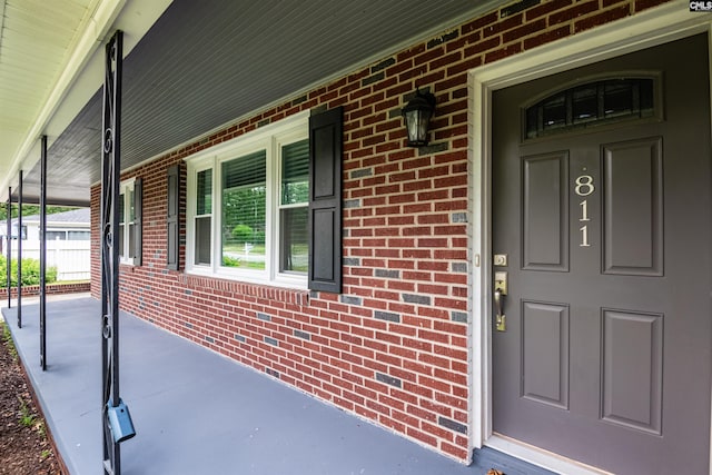 811 Rosedale Rd, West Columbia, SC 29170 - entrance to property featuring a porch and brick siding