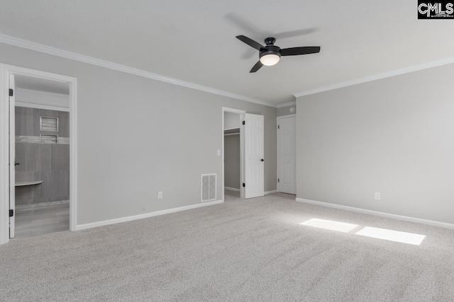 800 Valhalla Dr, Columbia, SC 29229 - unfurnished bedroom featuring carpet floors, ornamental molding, a walk in closet, ensuite bath, and a ceiling fan