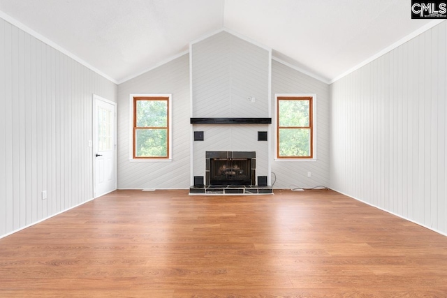 800 Valhalla Dr, Columbia, SC 29229 - unfurnished living room with lofted ceiling, light wood-type flooring, a tiled fireplace, and crown molding