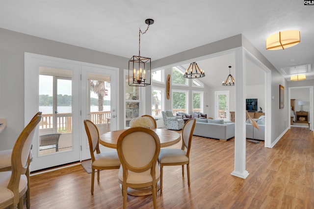 116 Laurel Rock Pt, Leesville, SC 29070 - dining room with light wood-style floors, a water view, attic access, and a chandelier