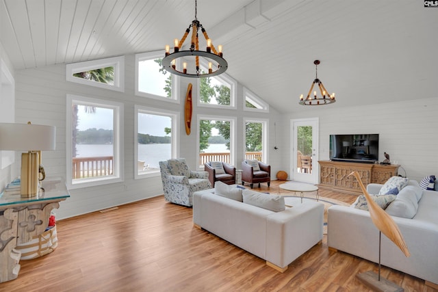 116 Laurel Rock Pt, Leesville, SC 29070 - living area featuring a chandelier, light wood-type flooring, a water view, wood walls, and high vaulted ceiling