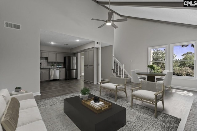 118 Tee Ct, Columbia, SC 29212 - living area with stairway, dark wood finished floors, a ceiling fan, high vaulted ceiling, and beam ceiling