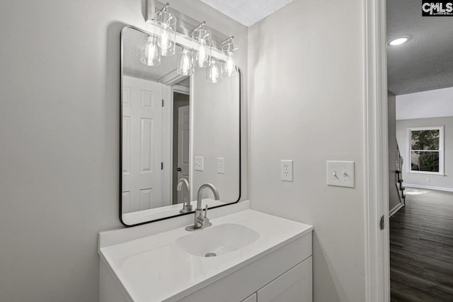 118 Tee Ct, Columbia, SC 29212 - bathroom featuring a textured ceiling, vanity, and wood finished floors