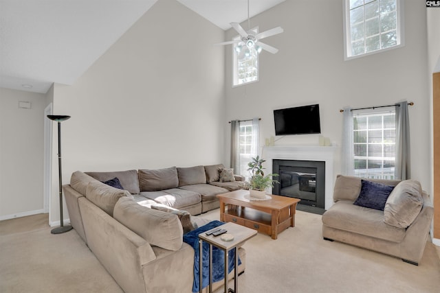 316 Founders Ridge Rd, Columbia, SC 29229 - carpeted living area with high vaulted ceiling, a fireplace with flush hearth, ceiling fan, and healthy amount of natural light