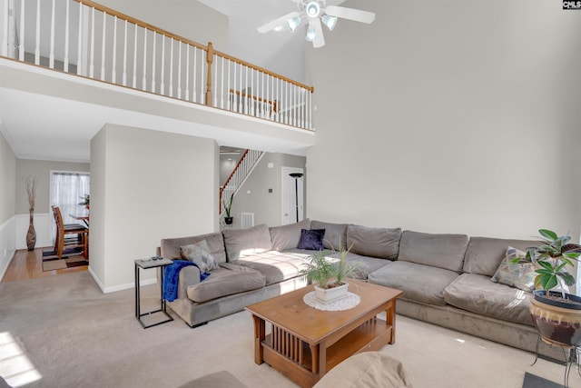 316 Founders Ridge Rd, Columbia, SC 29229 - carpeted living area featuring ceiling fan, a high ceiling, and stairway