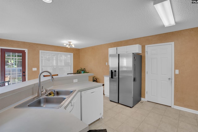 316 Founders Ridge Rd, Columbia, SC 29229 - kitchen with stainless steel fridge with ice dispenser, white dishwasher, a textured ceiling, white cabinets, and light countertops