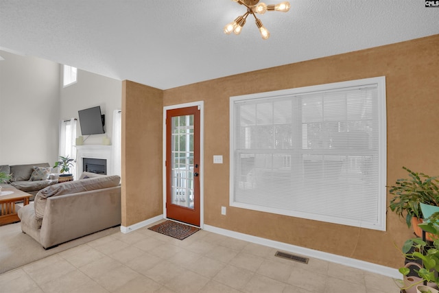 316 Founders Ridge Rd, Columbia, SC 29229 - living room with a chandelier, a fireplace, and a textured ceiling