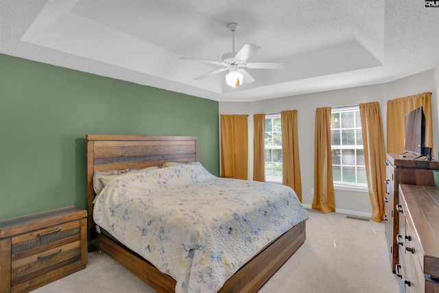 316 Founders Ridge Rd, Columbia, SC 29229 - bedroom with light carpet, a tray ceiling, a textured ceiling, and ceiling fan