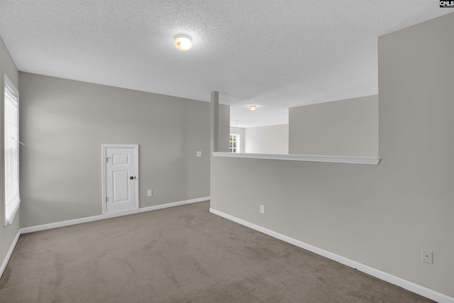 316 Founders Ridge Rd, Columbia, SC 29229 - empty room featuring a textured ceiling, plenty of natural light, and carpet