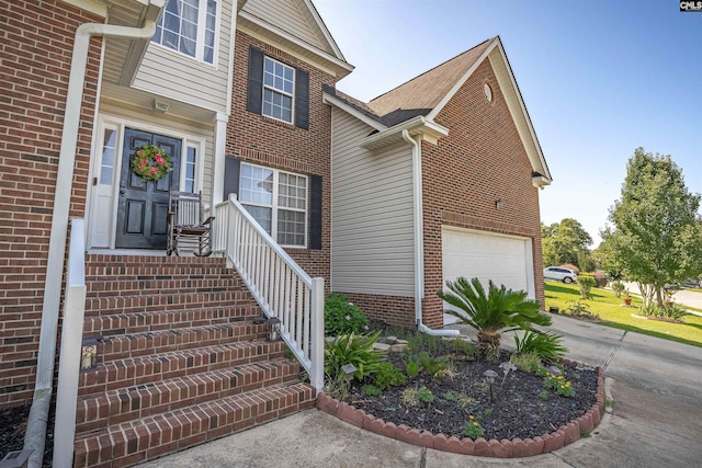 316 Founders Ridge Rd, Columbia, SC 29229 - doorway to property featuring an attached garage, concrete driveway, and brick siding