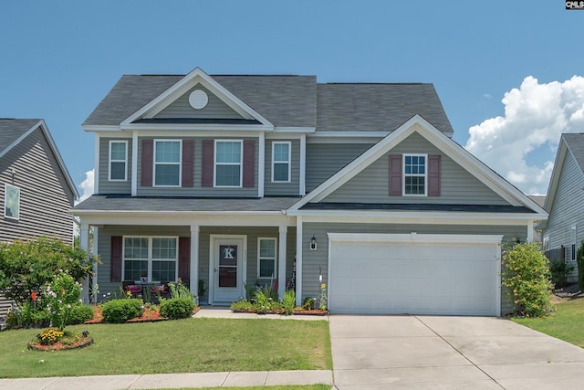 532 Ariel Cir, Lexington, SC 29072 - view of front of home featuring driveway, covered porch, a front lawn, a garage, and a shingled roof