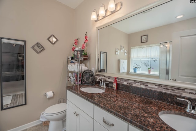 532 Ariel Cir, Lexington, SC 29072 - bathroom featuring backsplash, double vanity, and a shower with shower door